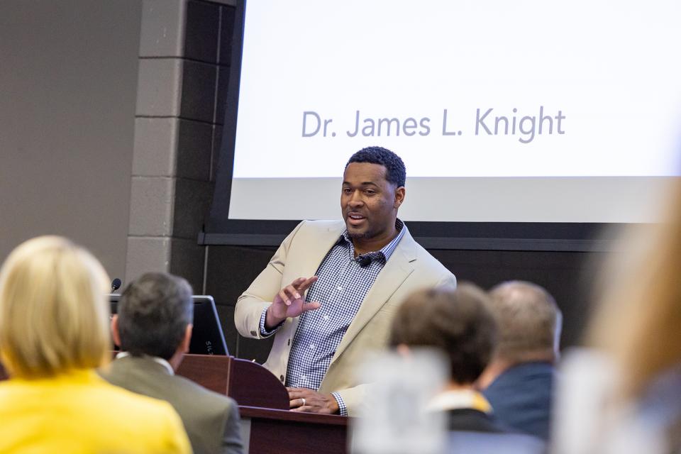 Dr. James Knights speaks to an audience at the 2023 Community Intercultural Relations Conference.