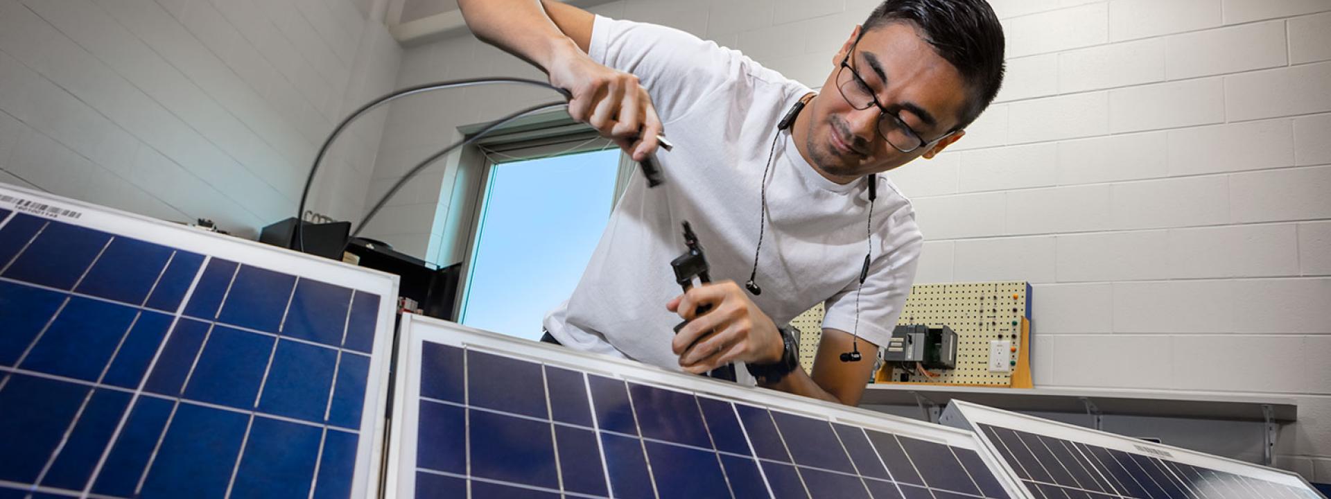 Engineering Student working on solar panels