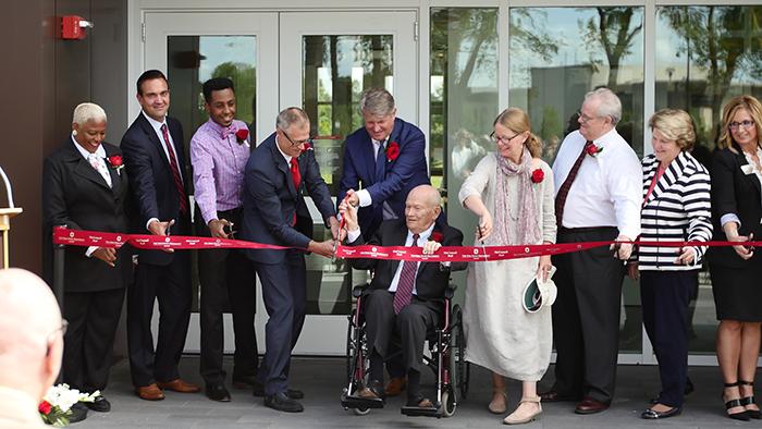 Ribbon being cut at McConnell Hall