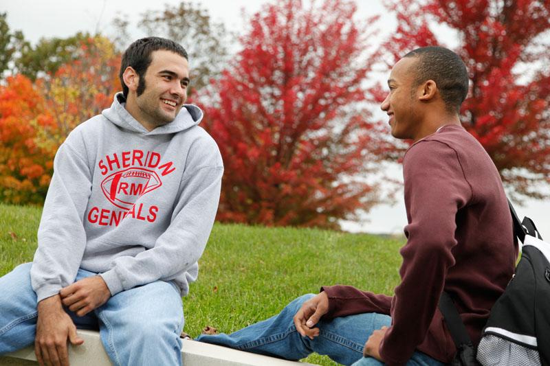 Two students hanging out on campus