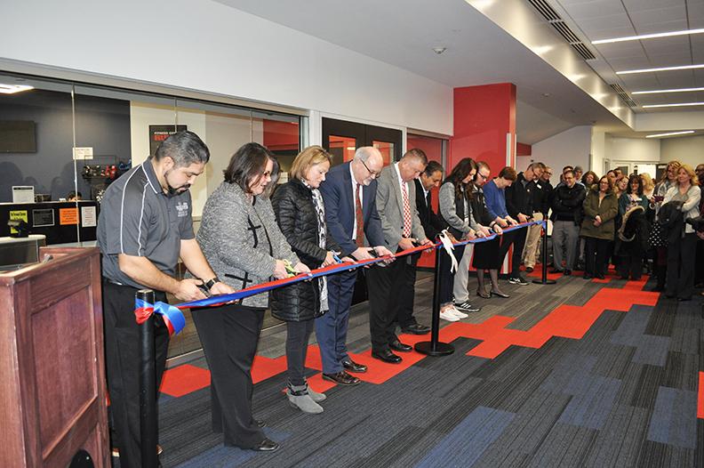 A Ribbon cutting inside Adena Hall
