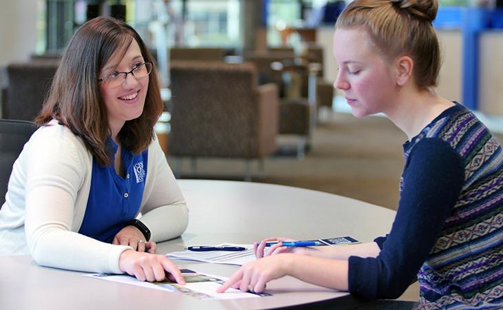 Two students in the gateway on campus