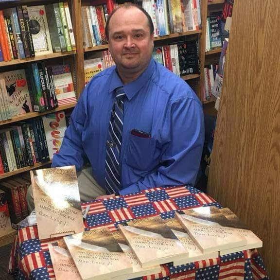 Dan Long Jr. with his first book, The Conflict Within: The Second American Civil War.