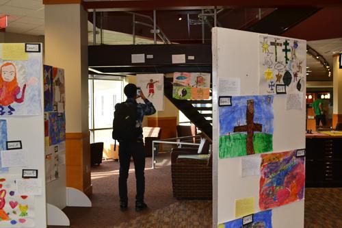 Student taking picture in the art gallery
