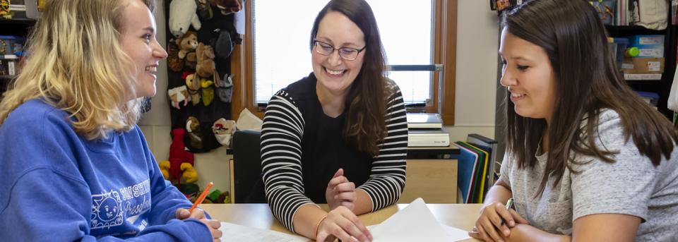 Advisor working with students