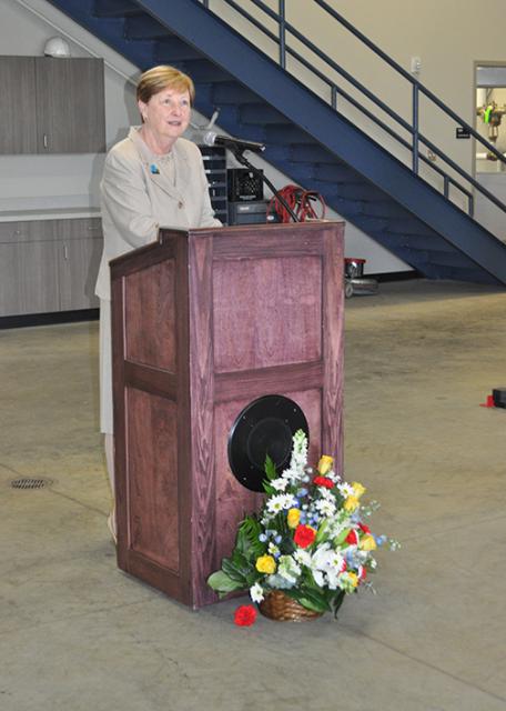 A woman speaking at the open house