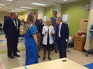 Group of people standing in a room talking