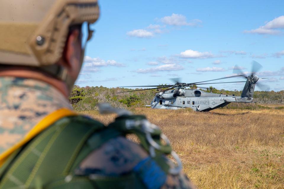 soldier looking at helicopter 