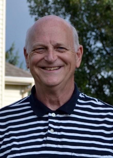Older man smiling at camera