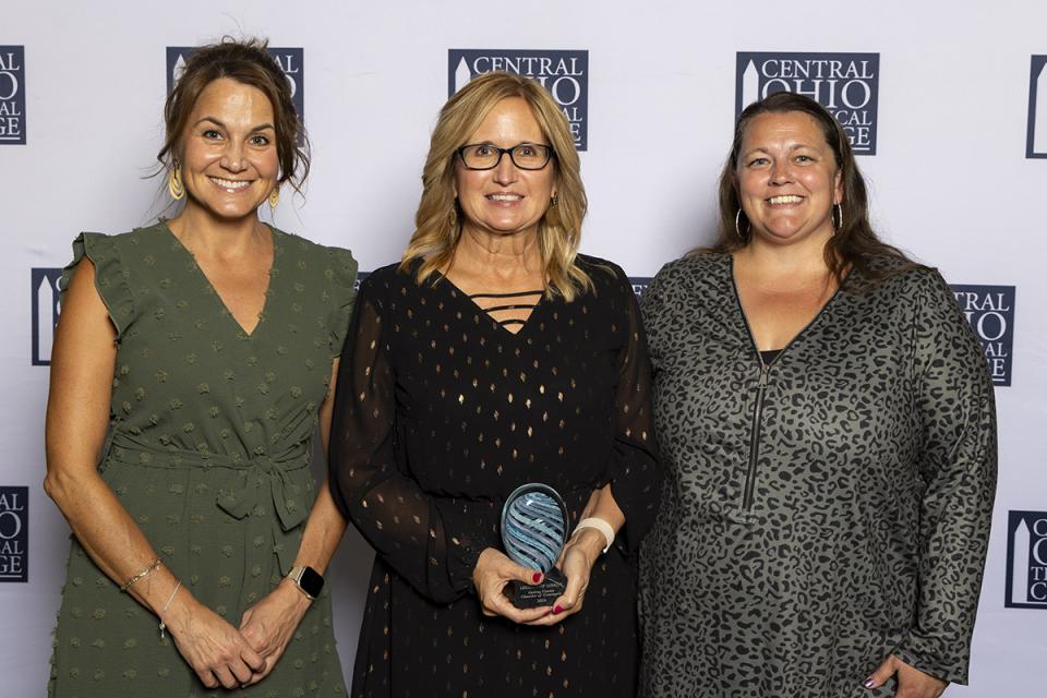 Portrait of Carrie Lonzo, Jennifer McDonald and Atrina Good representing the Licking County Chamber of Commerce holding their Legends of Loyalty Award.