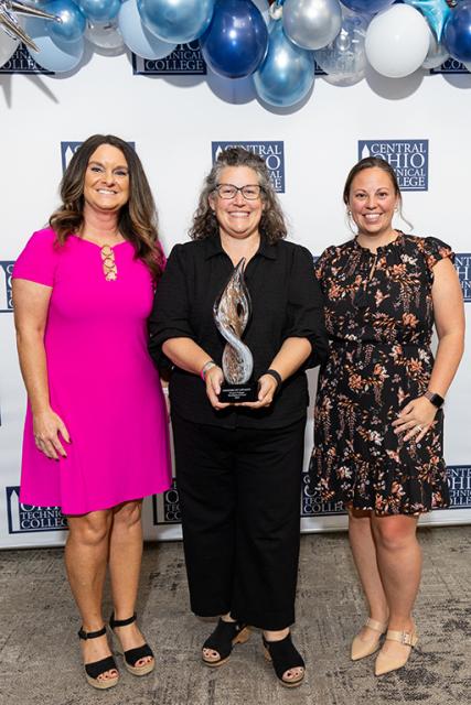 Julie Deibel, Jennifer Roberts and Micah Smith of the Newark Campus Development Fund Julie Deibel, Jennifer Roberts, and Micah Smith hold the Legends of Loyalty trophy for the Newark Campus Development Fund.