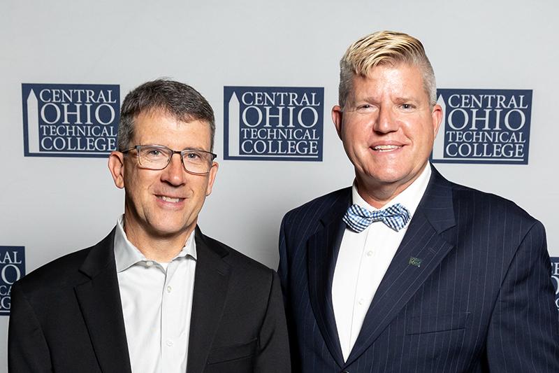 Portrait of David Brillhart standing next to John Berry.