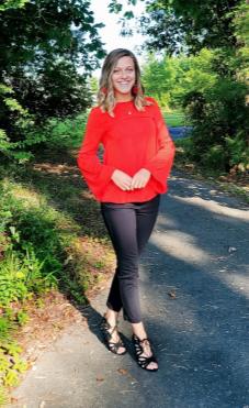 Sydney (girl)  walking on path wearing red shirt and jeans