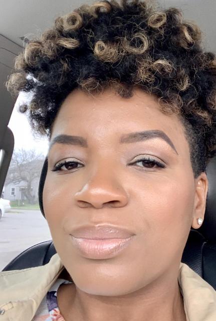 African American female smiling at camera, COTC nursing student Olivia Rhynehardt