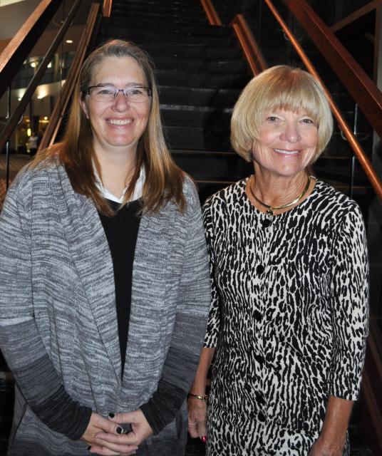 Two woman posing at the scholarship breakfast