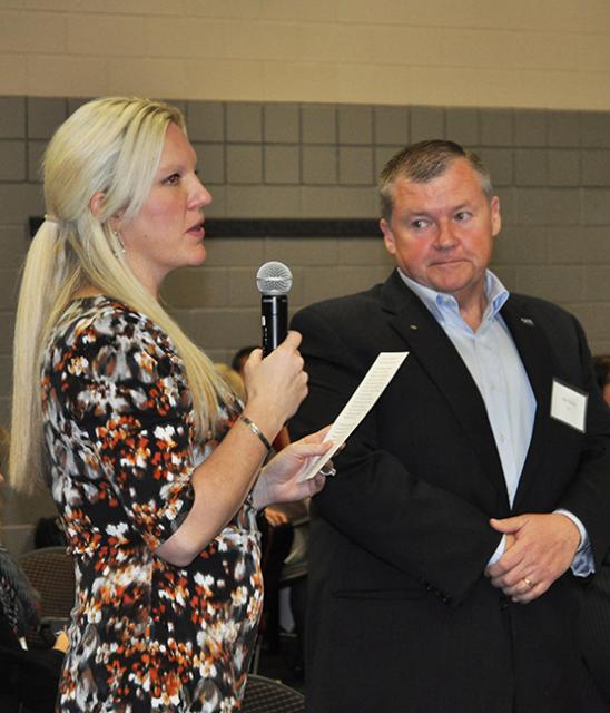 A Woman speaking at the scholarship breakfast