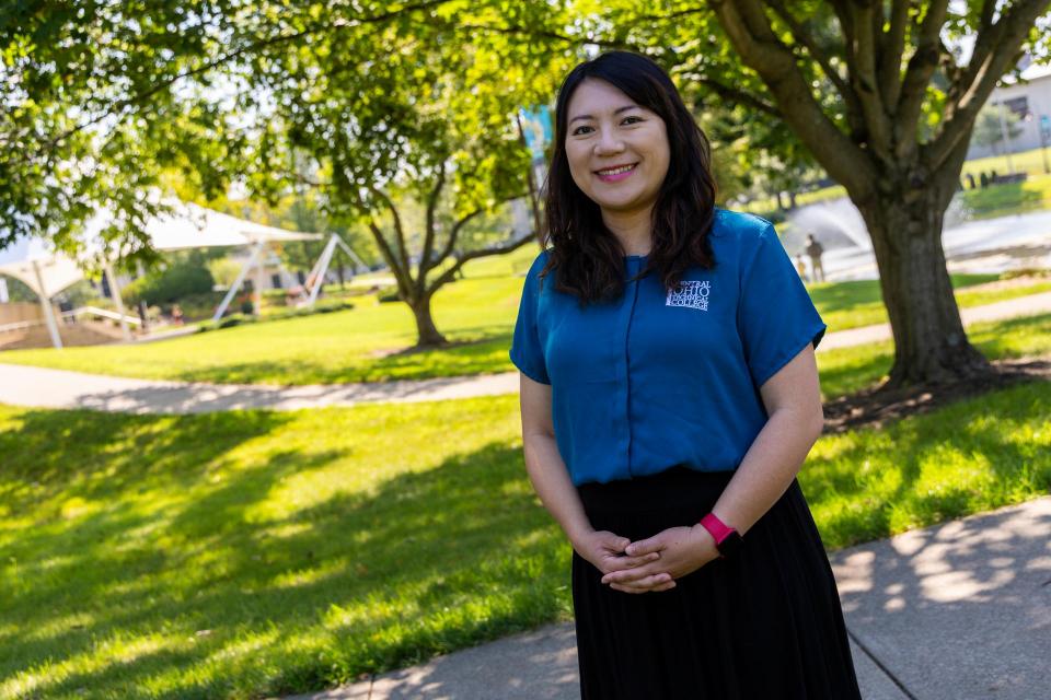 Assistant Professor Hsun-Yu (Sharon) Chuang, PhD, stands outside on the campus of COTC.