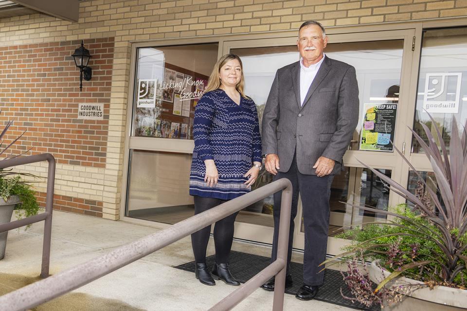 Sonja Darsee and Timothy Young stand in front of the Licking/Knox Goodwill Industries building.