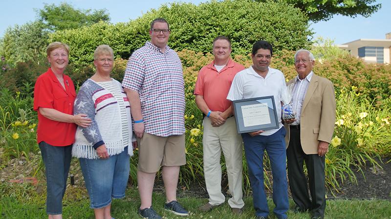 Alumni Julio Valladares receiving Community Service Award