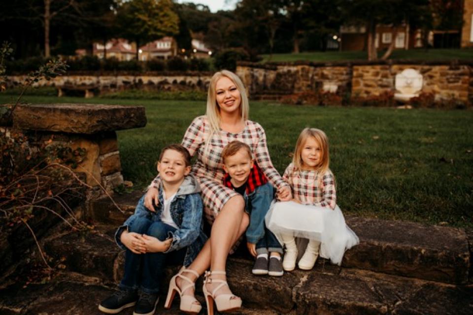 Portrait of Brittany Klinkert and her three children.