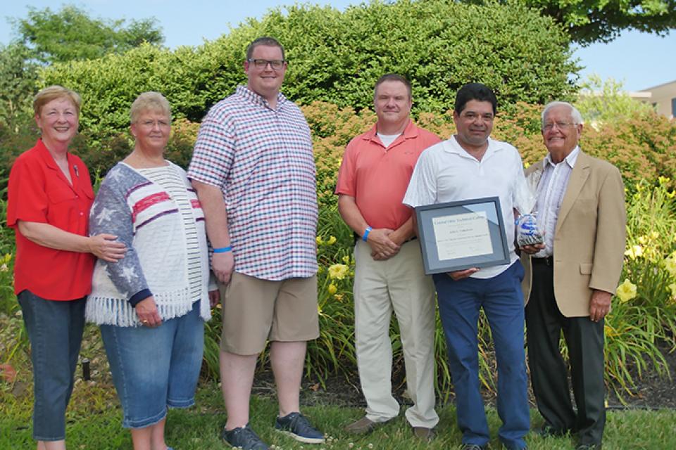 Alumni Julio Valladares receiving Community Service Award
