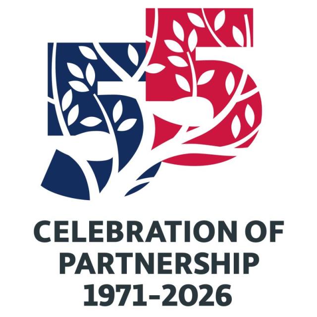 The anniversary mark with the number 55 and text below that says Celebration of Partnership 1971-2026.