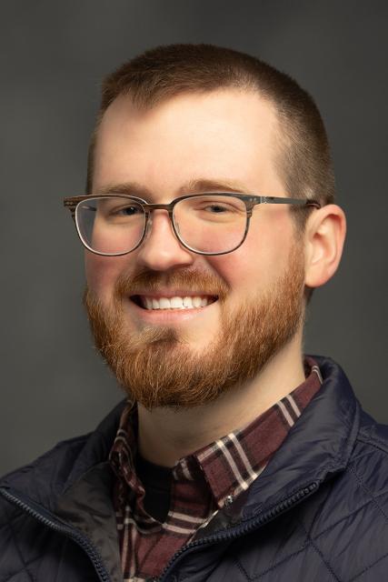 Headshot of Alex Wilson.