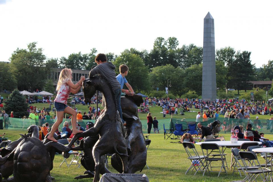 Kids  playing on a  statue