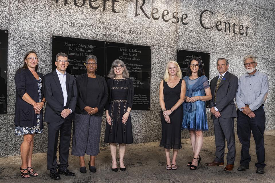 The Legends of Loyalty Award recipients stand in a line next to each for a portrait. 