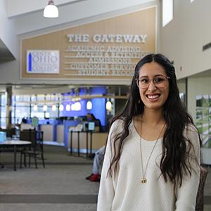 Young female smiling at camera, COTC student Juliette Pierce