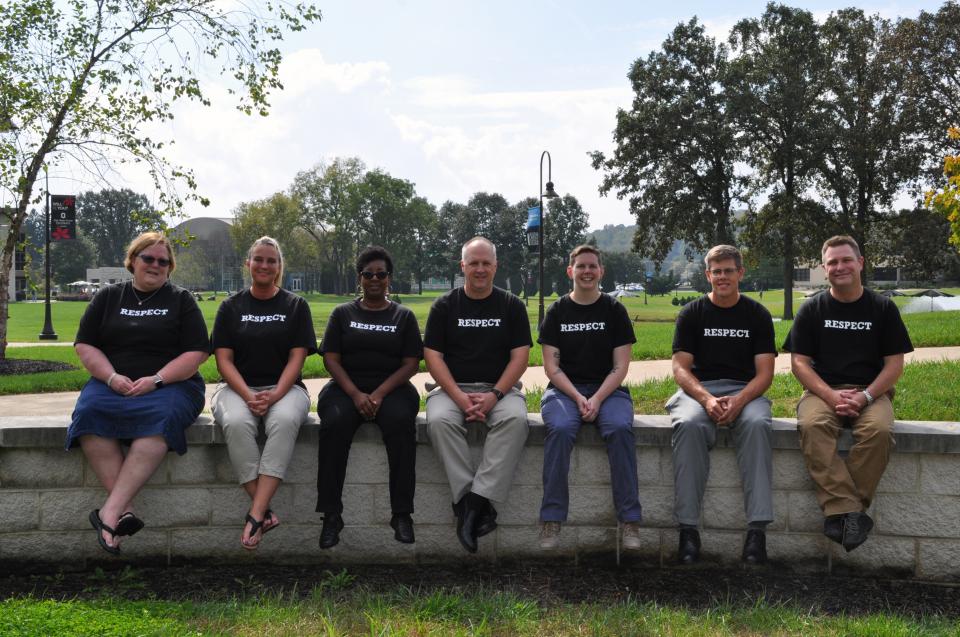 Group of people wearing "Respect" T-shirts